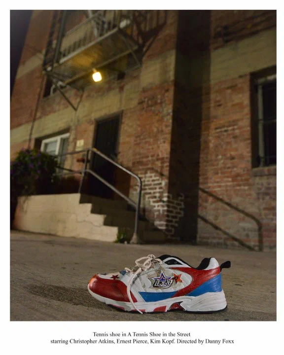 Постер: A Tennis Shoe in the Street