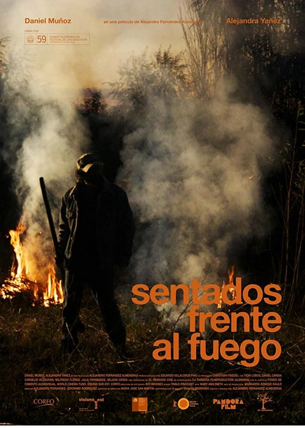 Постер: Sentados frente al fuego